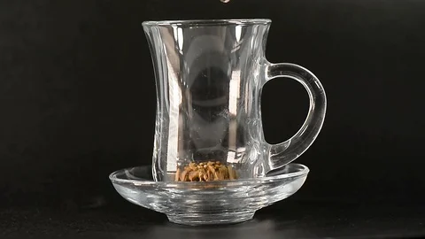 Turkish coffee in a transparent cup.The process of pouring coffee into a cup Stock Footage 127541877