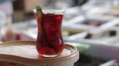 Turkish cup of hot tea is on the counter at the market Stock Footage 63430246