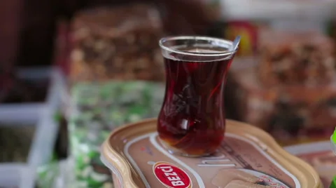 Turkish cup of hot tea is on the counter at the market Stock Footage 63430758