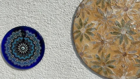 Turkish decorative blue evil eye amulet displayed on textured white wall ba.. Stock Footage 329062353