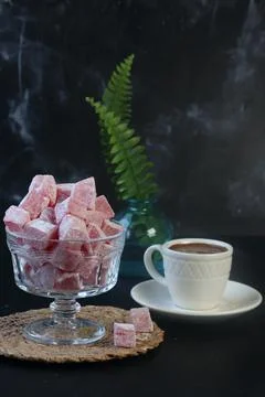 Turkish delight and Turkish coffee on a black background Stock Photos