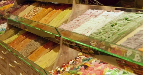 Turkish delight assortment displayed in illuminated market counter Stock Footage 339631335