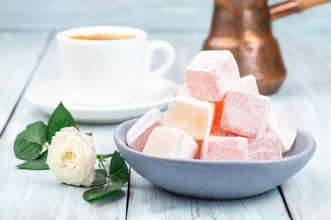 Turkish delight or lokum confection rose and lemon flavored with cup of coffee Stock Photos