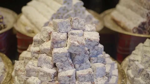 Turkish delights displayed in a market setting during a busy afternoon Stock Footage 345695182