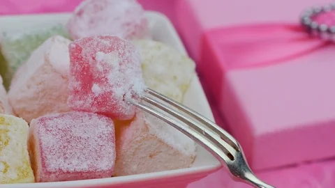Turkish delights with silver fork Stock Footage 87476252