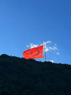 Turkish flag and clouds in a summer day Stock Photos