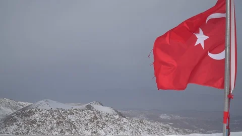 Turkish flag on a background of mountains and gray sky. Close-up Stock Footage 124008929