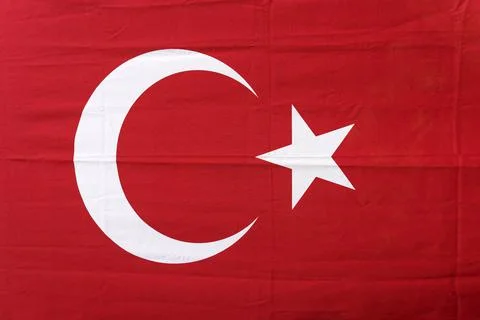 Turkish flag background. Red textile flag of Turkey on the streets of Istanbul Stock Photos