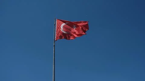 Turkish flag. Background sky. Foto stock