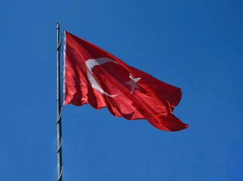 Turkish flag. Background sky. Stock Photos
