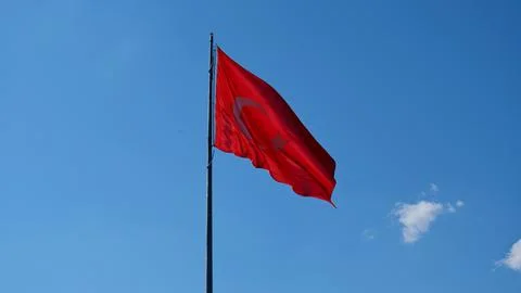 Turkish flag. Background sky. Foto stock