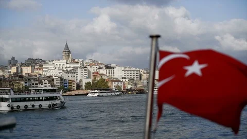 The Turkish flag is displayed on the flagpole of the ferry. In the background, t Stock Footage 127943769
