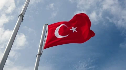 Turkish flag on flagpole flutters against the sky 스톡 동영상 304740595