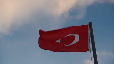The Turkish flag flies in the wind against the background of cloudy sky  Stock Footage 124008041