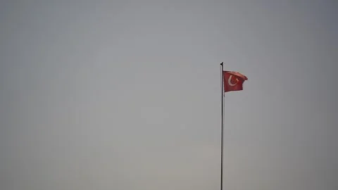 Turkish flag is fluttering on the flagpole in the wind. Turkish national flag. Video stock 320839579
