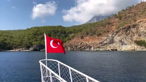 The Turkish flag flying over the sea. Turkish flag on the nose of the ship Stock Footage 164222453