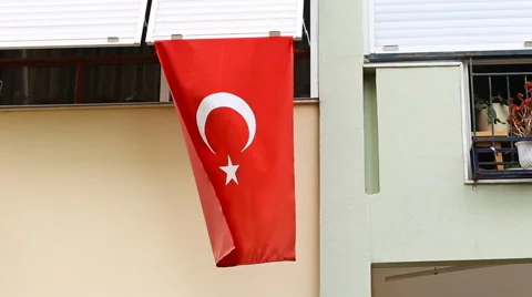 Turkish flag in front of a house Stock Footage 50542097