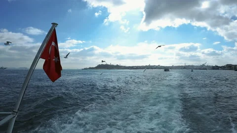Turkish flag on the moving ferry and seagulls Stock Footage 152015340
