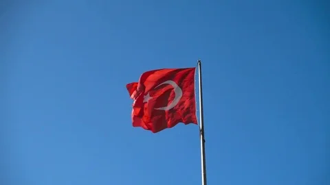 Turkish flag over blue sky in Istanbul, Turkey, 4k ultra hd video footage Stock Footage 84171617