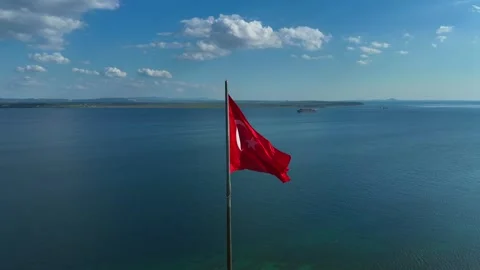 Turkish flag. Red Turkish flag waving on the sea Stock Footage 253820853