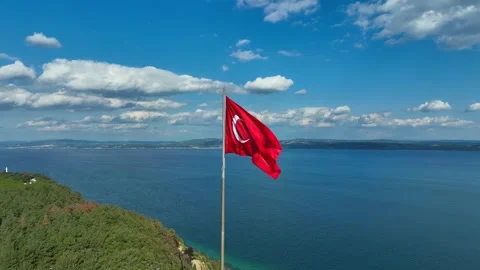 Turkish flag. Red Turkish flag waving on the sea Stock Footage 253820866