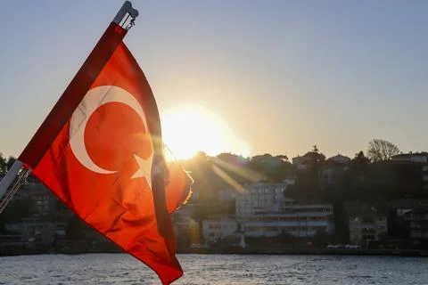 Turkish flag with sun star backlight on Bosphorus ferry, Istanbul, Turkey Stock Photos