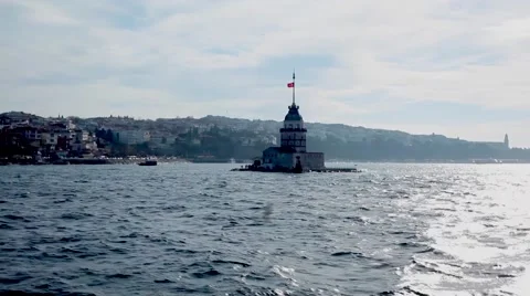 A Turkish flag waves on top of a lighthouse-like structure in the sea. Stock Footage 59309553