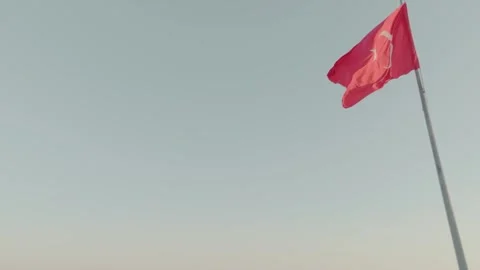 Turkish Flag Waving Against a Clear Sky Stock Footage 282925200