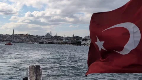 Turkish flag waving on a boat navigating the Bosphorus strait with the Istanbul Video stock 337807954