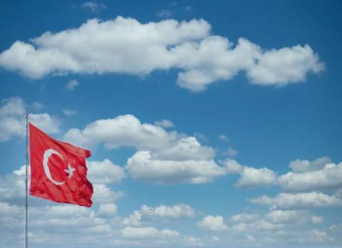 Turkish flag waving front of clouds. Stock Photos