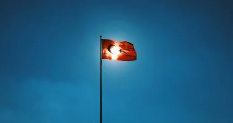 Turkish flag waving at sky with sun. Turkey country flag flowing in the wind in Stock Footage 103998357
