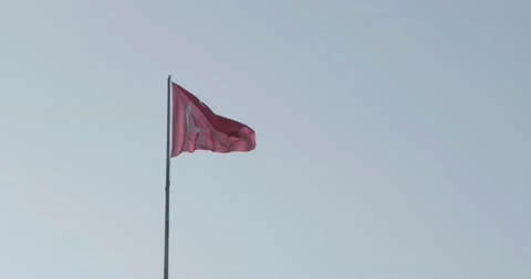 Turkish flag waving slowly in light wind in front of blue sky Video stock 134878464