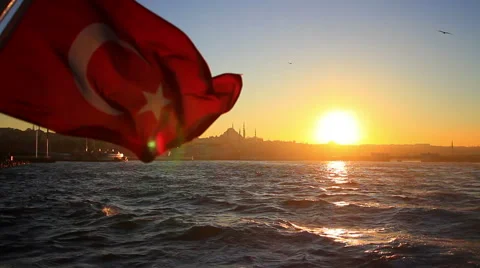 Turkish flag waving on the stern of an Istanbul ship at sunset Stock Footage