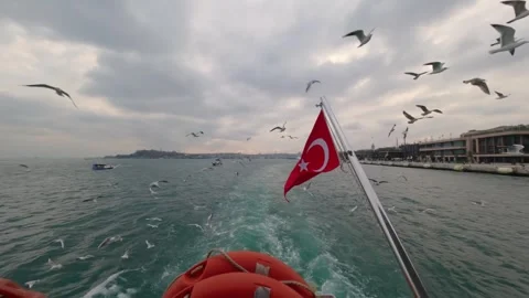 Turkish flag waving on the stern of a passenger ferry crossing the Bosphorus, Th Stock Footage 323393473