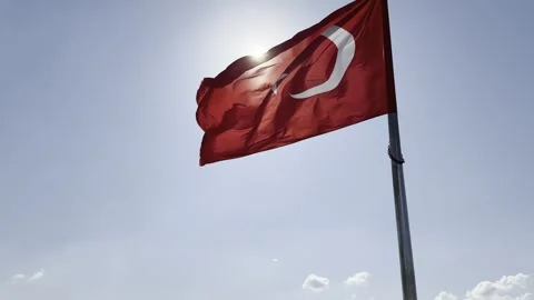 Turkish Flag Waving in Strong Wind Sun Flare Blue Sky Istanbul Turkey National S Video stock 324641600