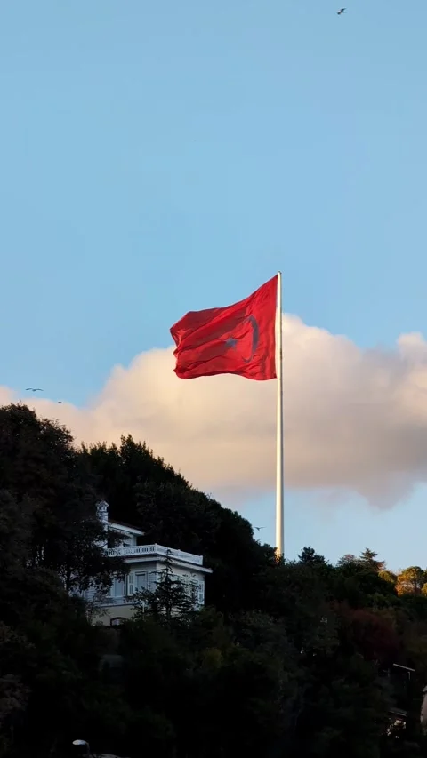 Turkish flag waving in wind against blue sky in Istanbul Video stock 335636549