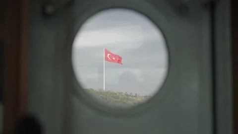 Turkish flag from the window of boat's window, bull's eye, fg01 Stock Footage 253875792