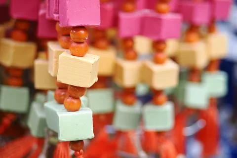 Turkish handmade soap strings hang in a market during a sunny day Foto stock