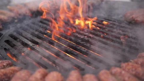 Turkish kebab is cooked on a circular grill in the open air. Stock-Footage 229556550