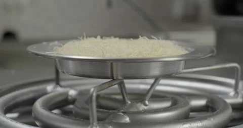 Turkish Kunefe or kunafa cooking on a stove. Kataifi dough in a copper plate Stock Footage 277660814