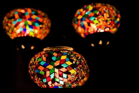 Turkish lanterns from small multi colored piece of glass hanging in the dark Stock Photos