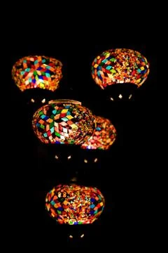 Turkish lanterns from small multi colored piece of glass hanging in the dark Stock Photos