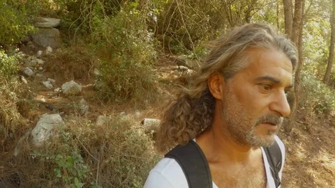 Turkish long-haired man close-up in ruins in the forest Stock Footage 81740027