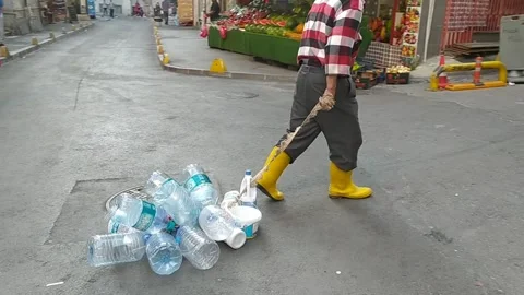 Turkish Man Dragging Reusable Water Bottles In Streets Of Istanbul, Turkey Stock Footage 244588326