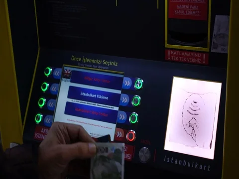 Turkish man paying at ticket machine in a bus station. 스톡 동영상 81132509