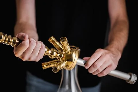 A turkish man show the methode of how to set up a hookah Stock Photos