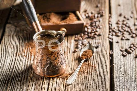 Turkish mocha in a copper jug Stock Photos