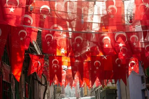 Turkish national flags on string in view Stock Photos