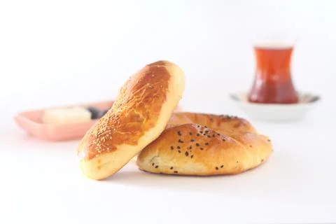 Turkish Pastry Pogaca and tea on white background. Traditional Bakery Stock Photos