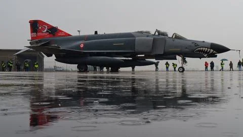 Turkish Phantom Parked in Rain Reflecting on Water. Copy Space Stock Photos